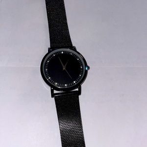 MSPCI Ladies Watch. This watch has a black mesh band.